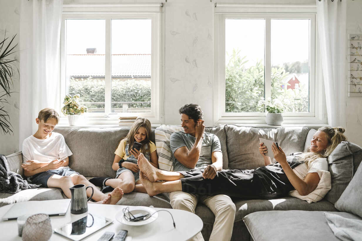 Hung Family Pictures In Living Room